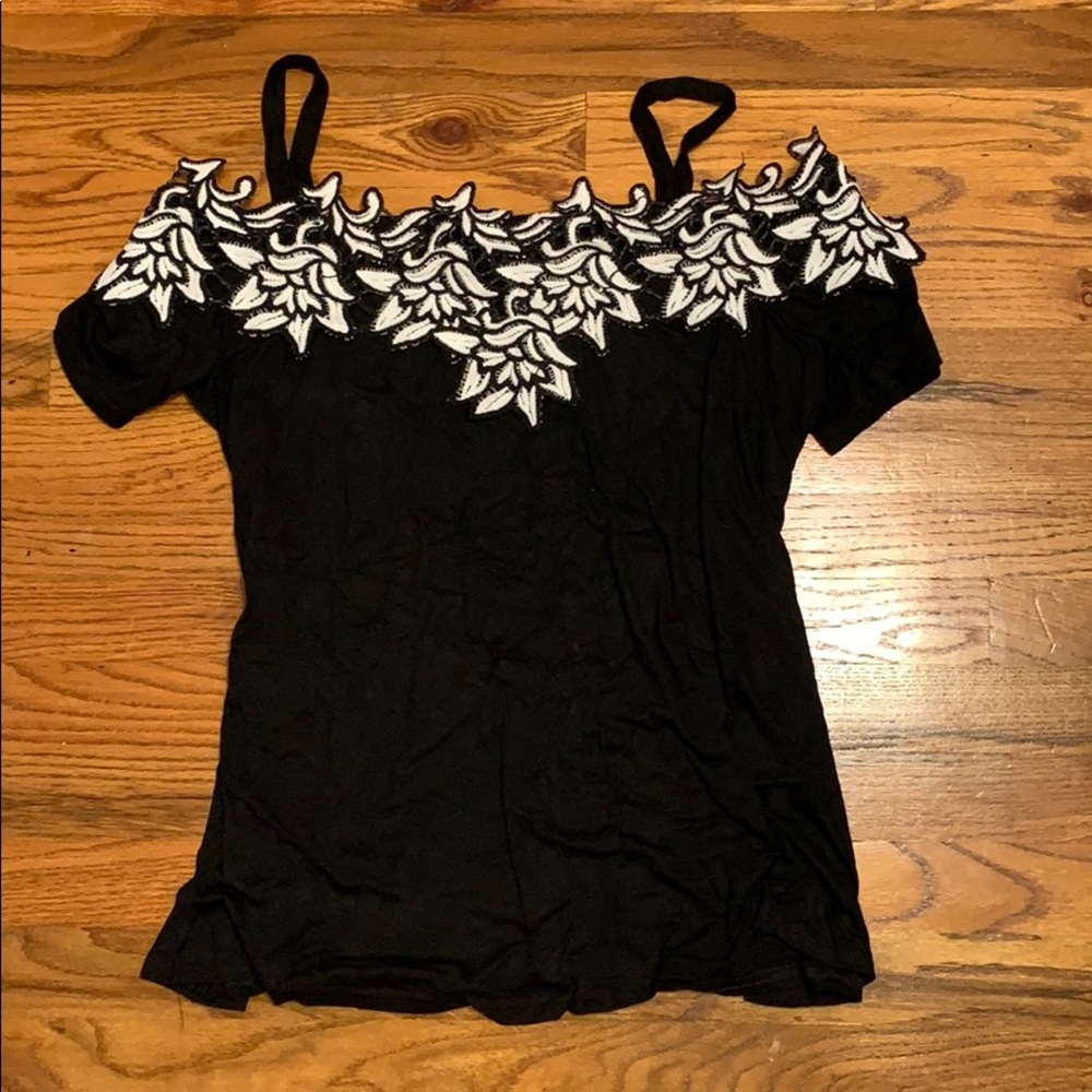 Black blouse with white floral trim